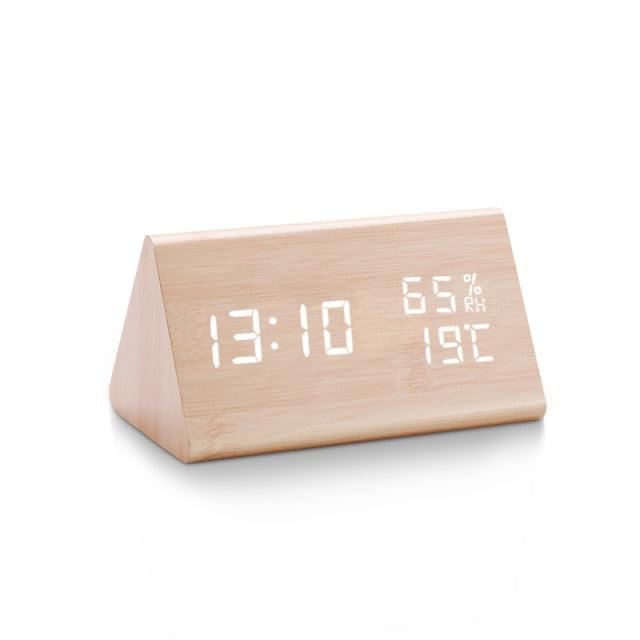 Wooden digital alarm clock with white LED time display and humidity/temperature readouts on desk on Tampa Home & Garden Store