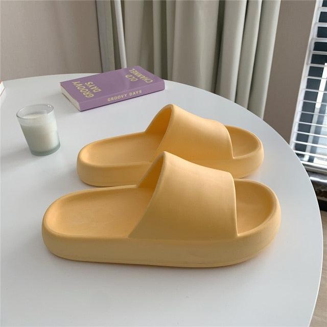 Stevvex Soft Eva Light Sandal slippers, pale yellow EVA slides for indoor wear, pair on table on Tampa Home & Garden Store