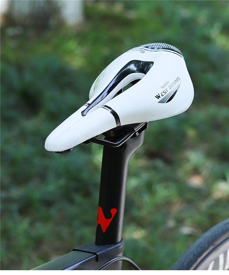 Leather bike saddle white with hollow cutout Stevvex road bike front seat on black seat post on Tampa Home & Garden Store