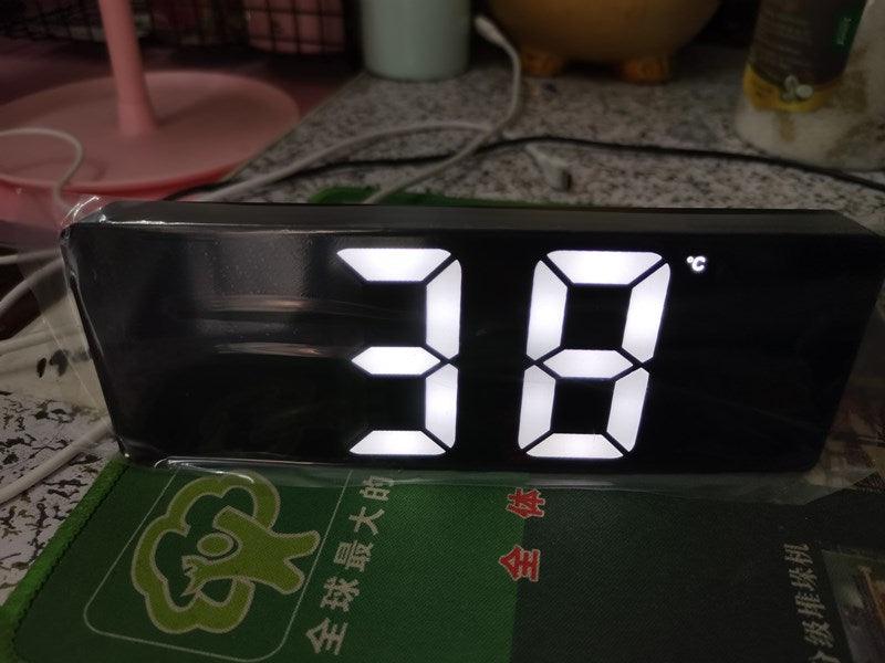 Stevvex acrylic mirror LED alarm clock with large white digits on a black reflective surface on Tampa Home & Garden Store