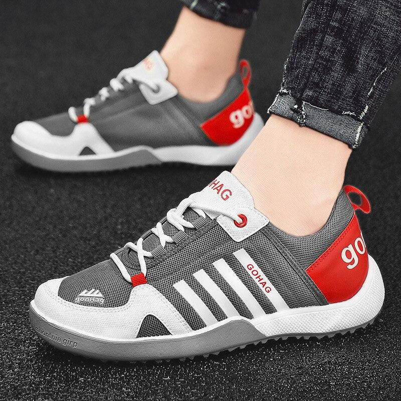 Gray mesh sneakers by Stevvex GOHAG with white stripes and red heel patch casual runners on Tampa Home & Garden Store