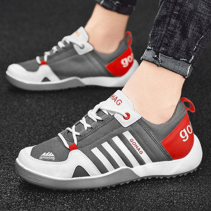 Gray mesh sneakers by Stevvex GOHAG with white stripes and red heel patch casual runners on Tampa Home & Garden Store