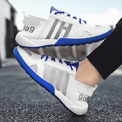 Men's white mesh sneakers, blue outsole and laces, lightweight breathable athletic pair on Tampa Home & Garden Store