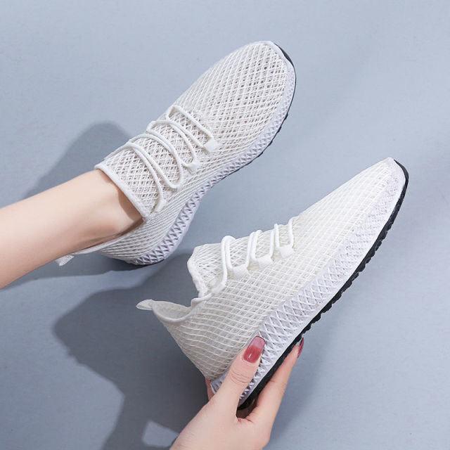 Stevvex pair of women's white running sneakers with breathable mesh, lightweight walking shoes on Tampa Home & Garden Store