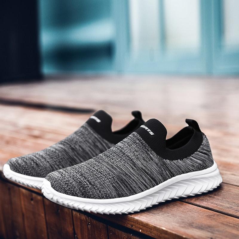 Stevvex grey knit slip-on sneakers with white cushioned outsole, casual walking shoes pair on Tampa Home & Garden Store