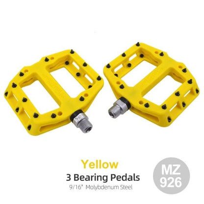 Pair of yellow flat platform bicycle pedals with non-slip studs on Tampa Home & Garden Store