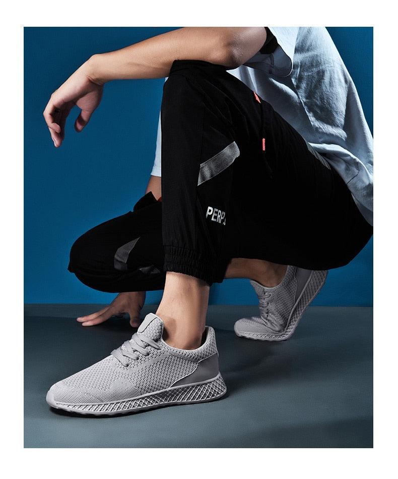 Men's Stevvex gray knit sneakers with breathable mesh, lace-up running shoes pair on Tampa Home & Garden Store