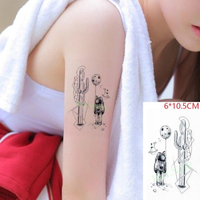 Stevvex waterproof temporary tattoo on forearm with geometric cactus and tiny astronaut on Tampa Home & Garden Store