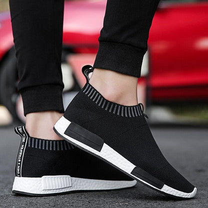 Men's black knit sock-style running sneakers by Stevvex with white sole and heel pull tab on Tampa Home & Garden Store
