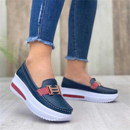 Women’s navy espadrille sneakers with red strap and gold buckle, white sole on Tampa Home & Garden Store
