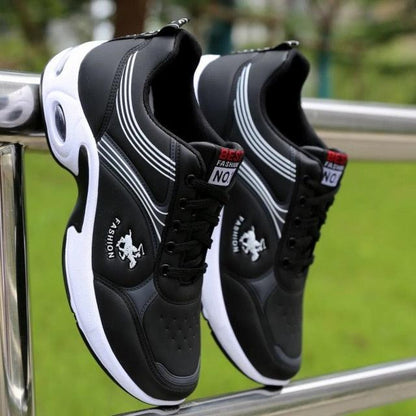 Stevvex men's leather casual sneakers, black with white sole, two sneakers on railing on Tampa Home & Garden Store