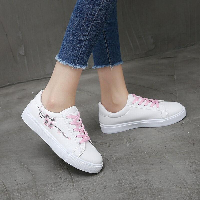 White PU leather platform sneakers pair by Stevvex with pink laces and floral embroidery on Tampa Home & Garden Store