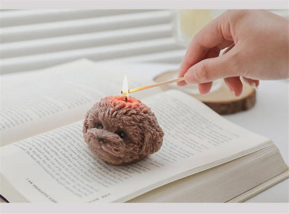 Bear-shaped scented candle, brown plush texture, lit wick on head on Tampa Home & Garden Store