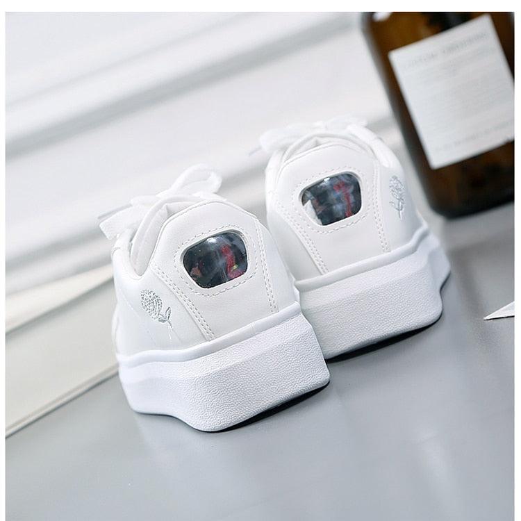 Women’s white Stevvex sneakers with embroidered flower, lace-up low-top pair on Tampa Home & Garden Store