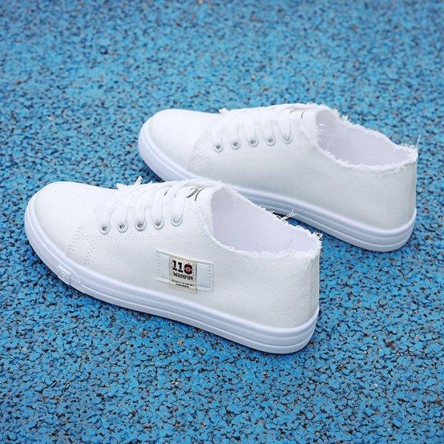 Women white canvas sneakers with lace-up front, frayed ankle openings, low-top casual Stevvex on Tampa Home & Garden Store