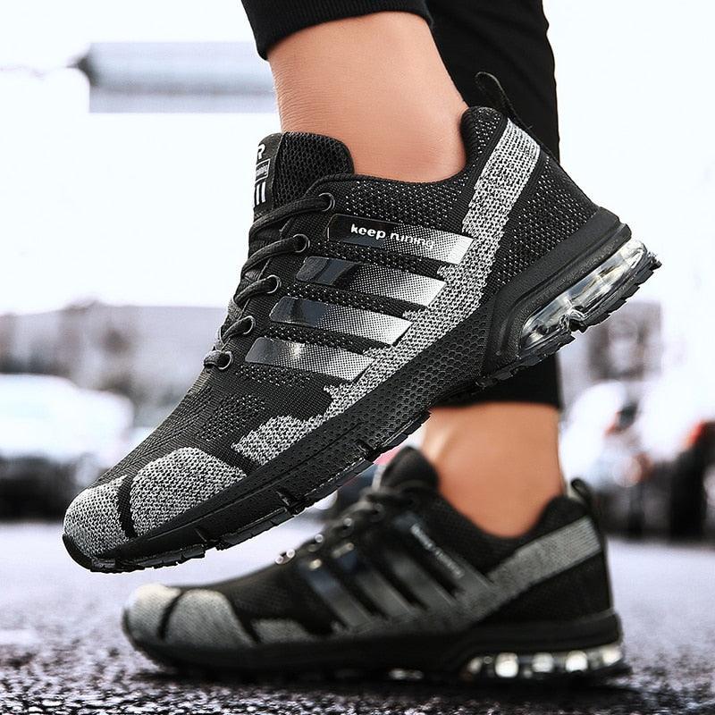 Stevvex running sneakers pair with black gray knit upper, lace-up, and air cushion sole on Tampa Home & Garden Store