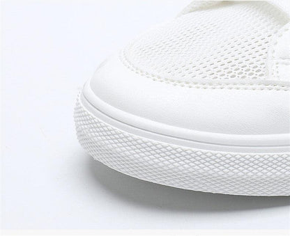 Women's white mesh sneakers with breathable upper and chunky textured sole on Tampa Home & Garden Store