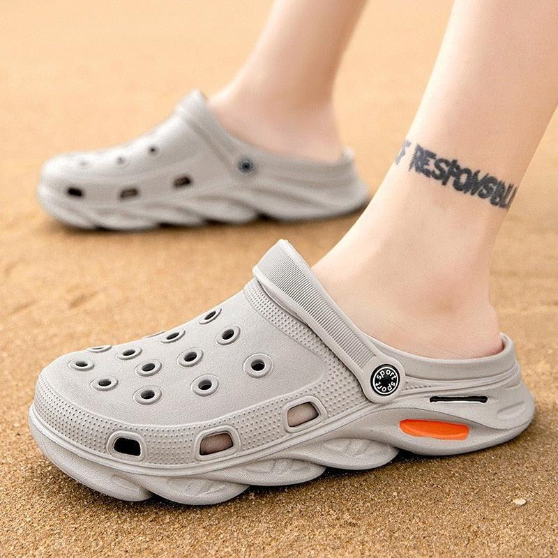 Stevvex gray outdoor sandals with perforated upper, back strap, and orange accent sole on Tampa Home & Garden Store