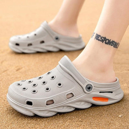 Stevvex gray outdoor sandals with perforated upper, back strap, and orange accent sole on Tampa Home & Garden Store