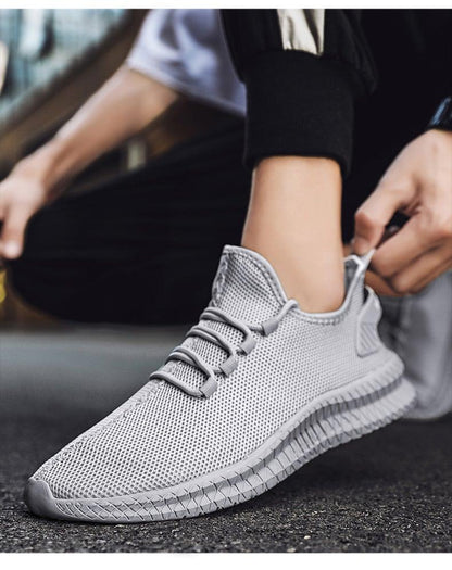 Stevvex men's light grey mesh running sneaker with breathable knit upper and non-slip grip sole on Tampa Home & Garden Store