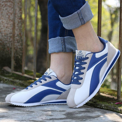 Athletic running sneakers blue and white with gray accents, pair on Tampa Home & Garden Store