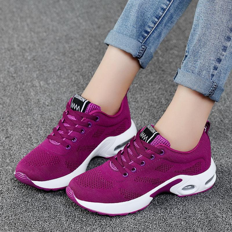 Women's athletic sneakers by Stevvex with magenta mesh upper and white air cushion sole on Tampa Home & Garden Store