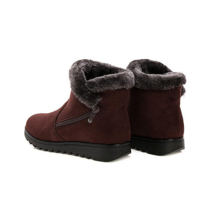 Red women's ankle boots with faux fur lining and black lug sole on Tampa Home & Garden Store