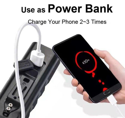Power bank charging a smartphone with white USB cable; compact black external battery pack on Tampa Home & Garden Store