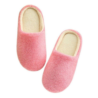 Pair of pink plush women's slippers with fur lining for indoor comfort on Tampa Home & Garden Store