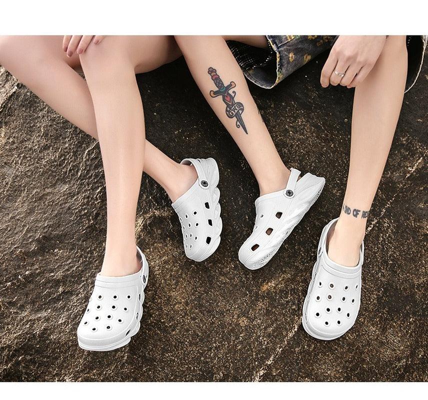 Three white outdoor sandals with ventilation holes, lightweight beach clogs on Tampa Home & Garden Store