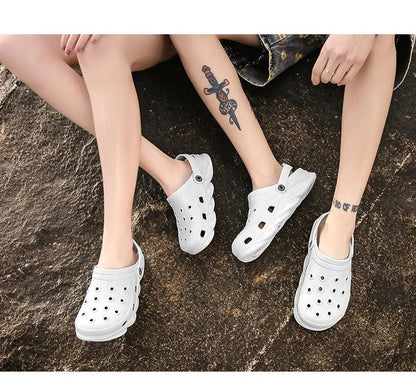 Three white outdoor sandals with ventilation holes, lightweight beach clogs on Tampa Home & Garden Store