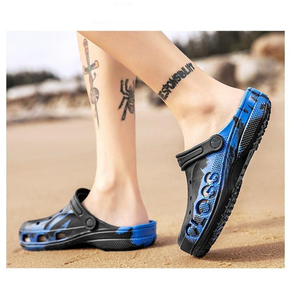 Stevvex blue-black garden clogs on sand; breathable slip-ons with anti-skid sole on Tampa Home & Garden Store