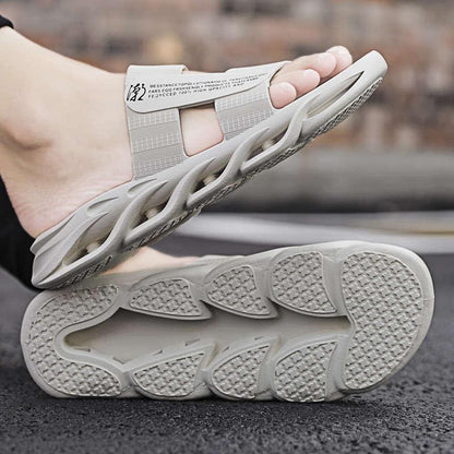 Men's Stevvex grey memory foam slide slippers with sculpted strap and textured outsole on Tampa Home & Garden Store