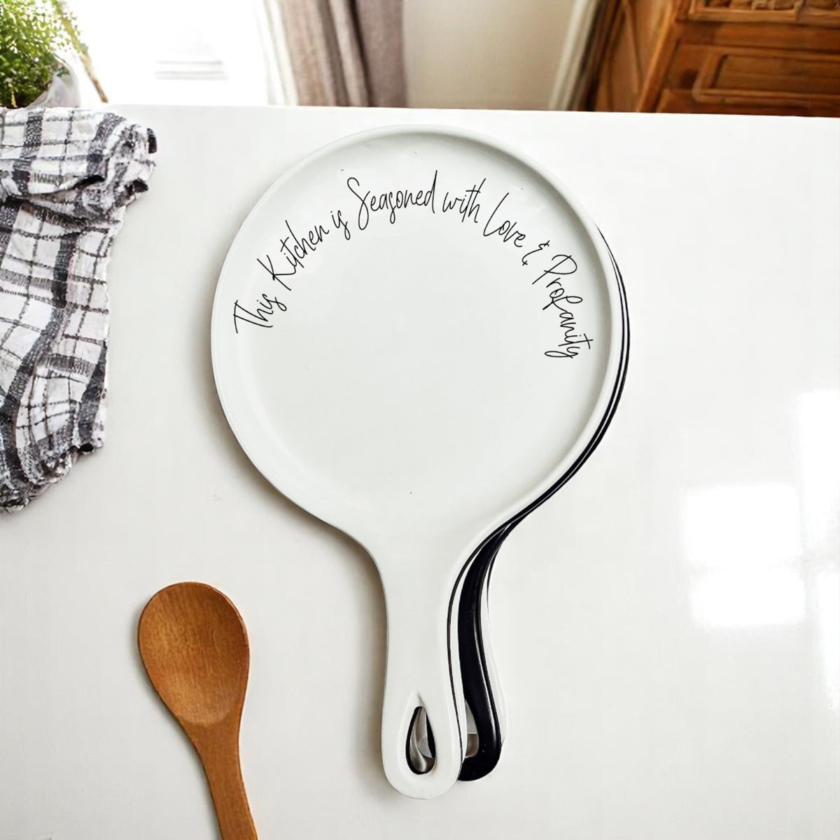 Love & Profanity spoon rests by Gia Roma, two white ceramic kitchen accessories with script on Tampa Home & Garden Store