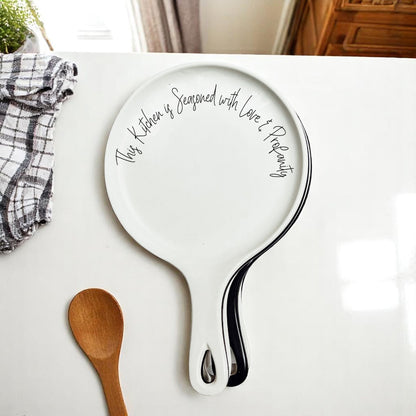 Love & Profanity spoon rests by Gia Roma, two white ceramic kitchen accessories with script on Tampa Home & Garden Store