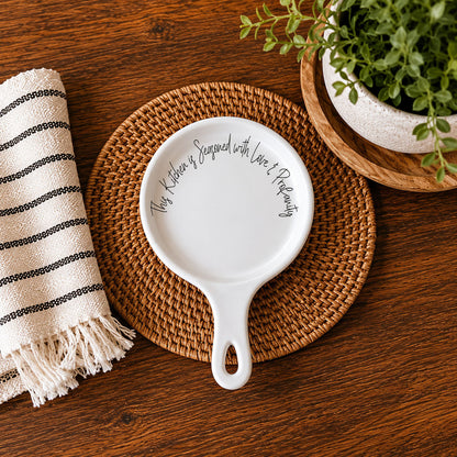 Love & Profanity spoon rest, white ceramic with cursive text, on placemat on wood table, on Tampa Home & Garden Store