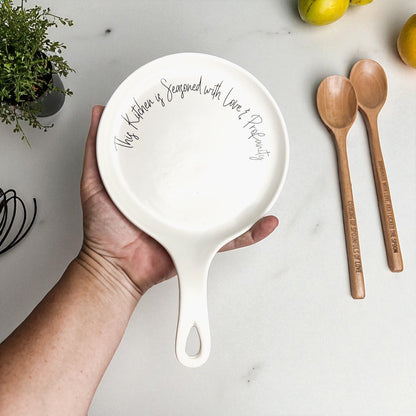 Love & Profanity spoon rest by Gia Roma, round white ceramic with script around rim on Tampa Home & Garden Store