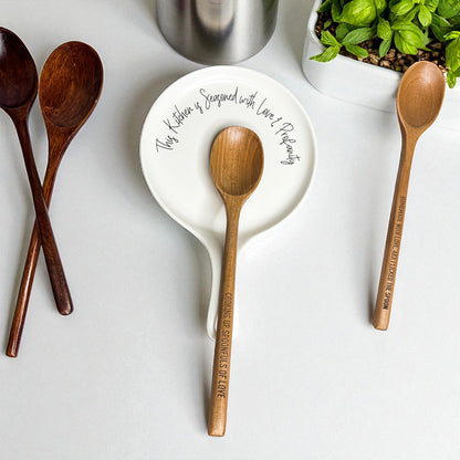 Love & Profanity spoon rest by Gia Roma; white ceramic plate with quote amid wooden spoons on Tampa Home & Garden Store
