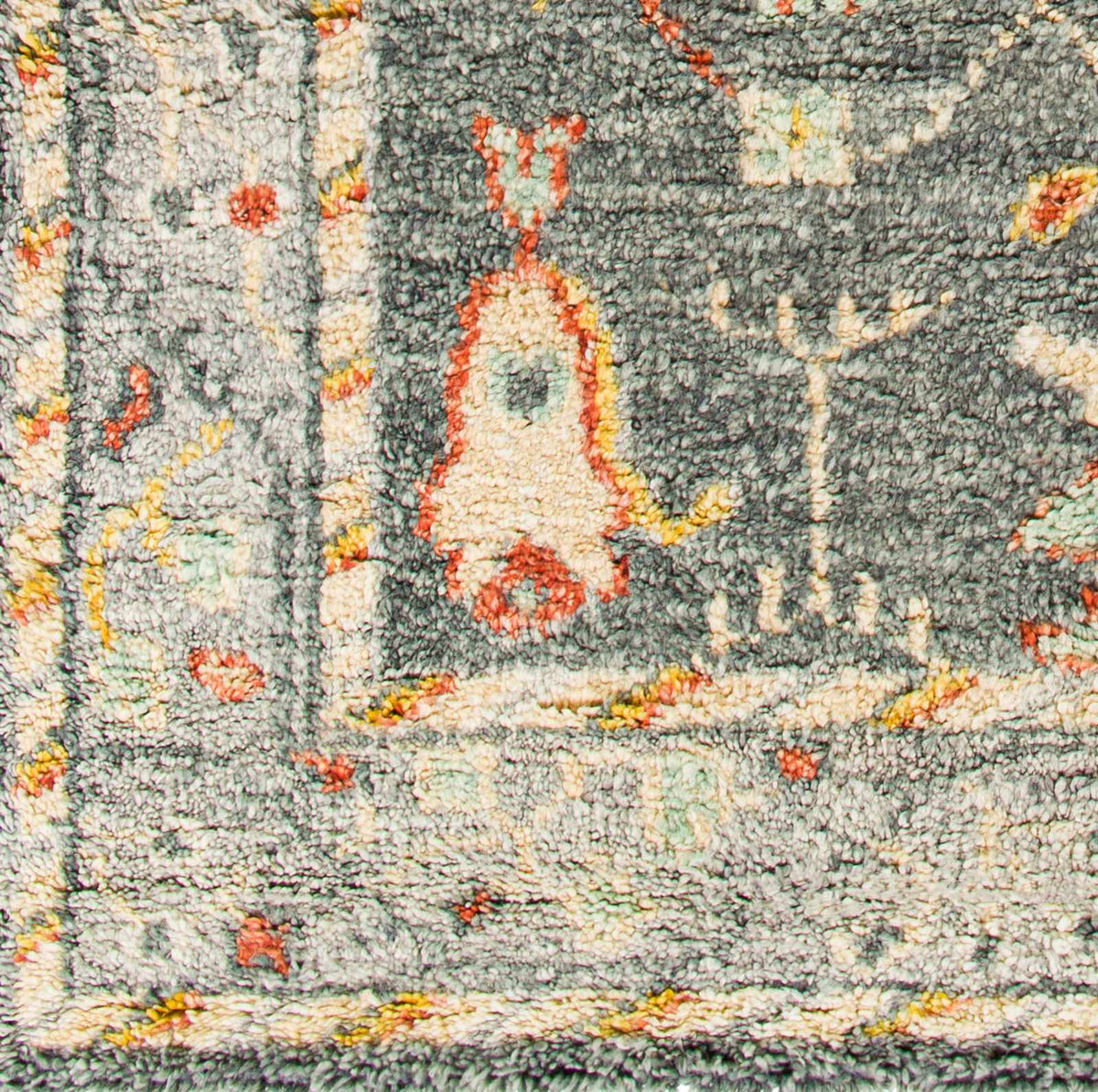 Prosperidad Handmade Wool Rug thick pile in gray-green with orange accents by Boutique Rugs on Tampa Home & Garden Store