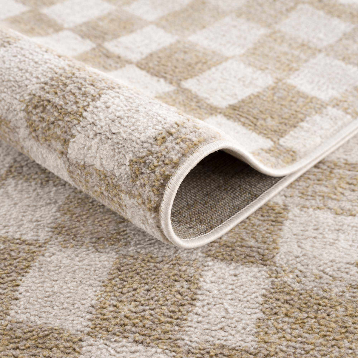 Benjy irregular checkboard rug closeup in cream and gold with textured pile Boutique Rugs on Tampa Home & Garden Store