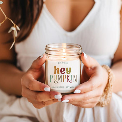 Baked Pumpkin Candle by Gia Roma in a clear glass jar with white label and warm glow on Tampa Home & Garden Store