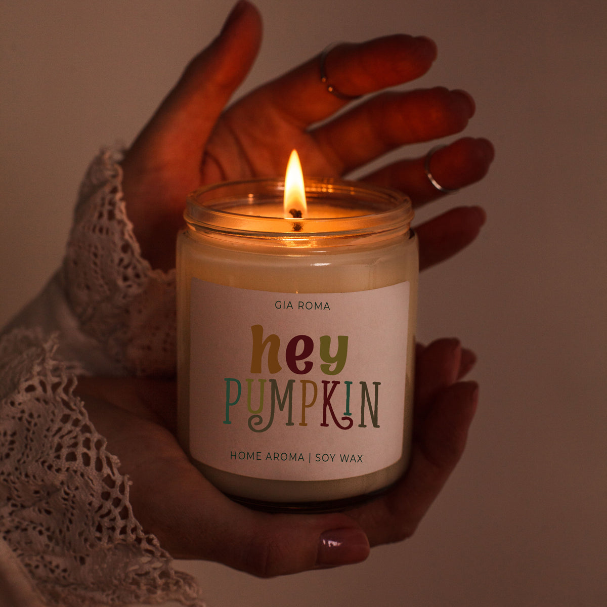 Candle Baked Pumpkin by Gia Roma, soy wax, warm glow held by hands on Tampa Home & Garden Store