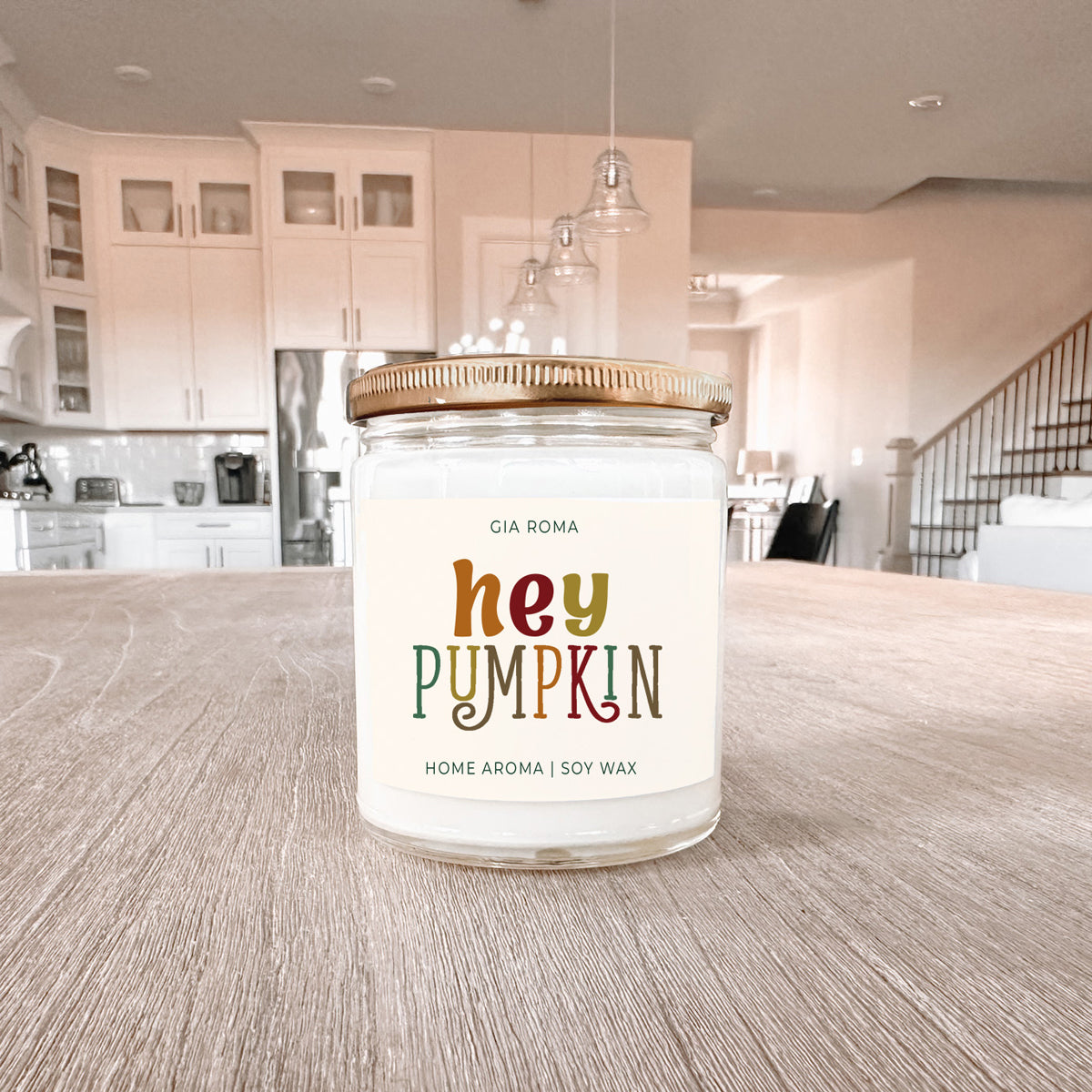 Baked Pumpkin candle by Gia Roma, soy wax in a clear glass jar with a gold lid on Tampa Home & Garden Store