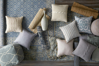 Sherwood Area Rug by Boutique Rugs in blue ivory geometric pattern with multiple pillows on Tampa Home & Garden Store