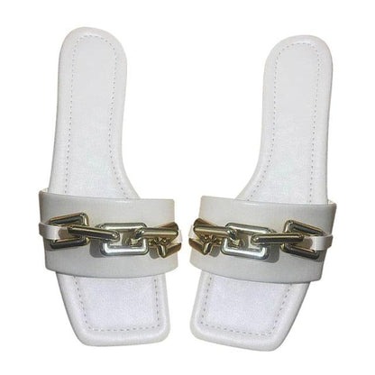 White leather slide sandals with a gold chain across the strap, pair on Tampa Home & Garden Store