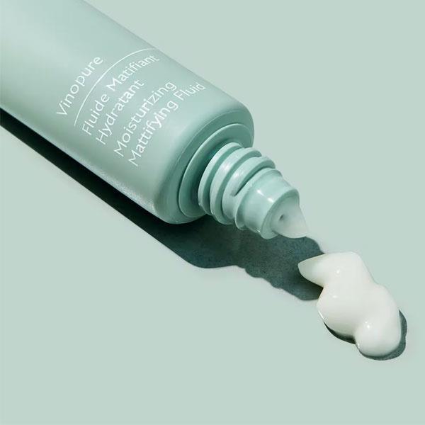 Caudalie Vinopure Mattifying Fluid teal bottle with creamy white moisturizer on Tampa Home & Garden Store