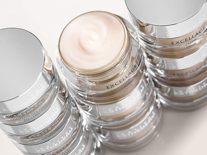 Institut Esthederm Excellage Cream face cream jars with silver lids, stacked on Tampa Home & Garden Store