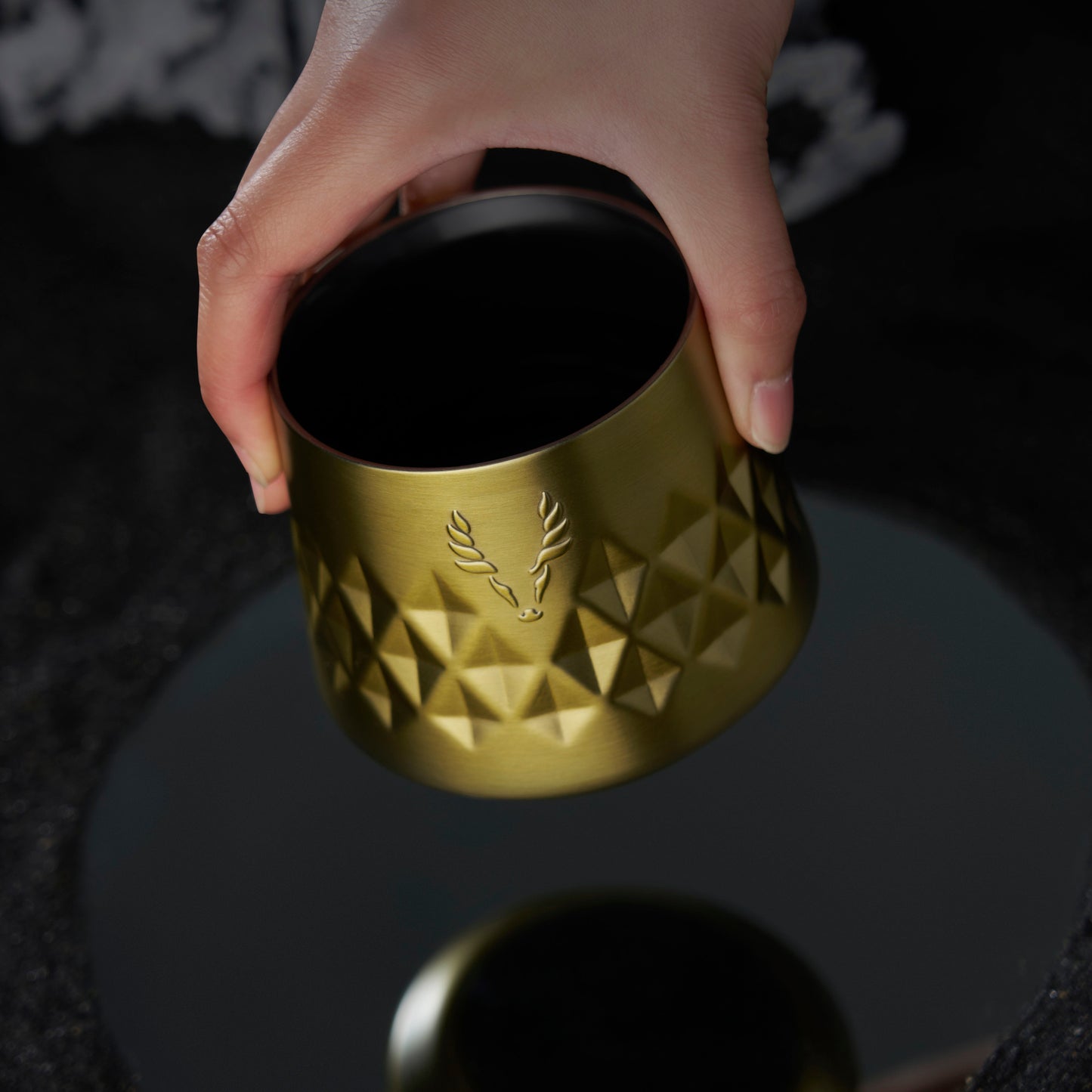 a Paragon Gold and Stainless Whiskey Taster Mug