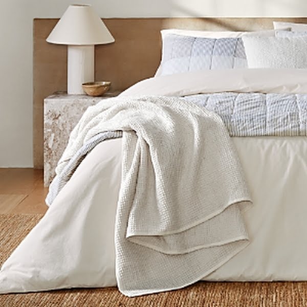 Nate Home by Nate Berkus Waffle Blanket, Queen; ivory waffle knit draped over white bedding on bed on Tampa Home & Garden Store