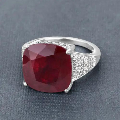 Sterling silver ring featuring a large cushion-cut dyed ruby centerpiece and pavé white topaz shoulders on Tampa Home & Garden Store